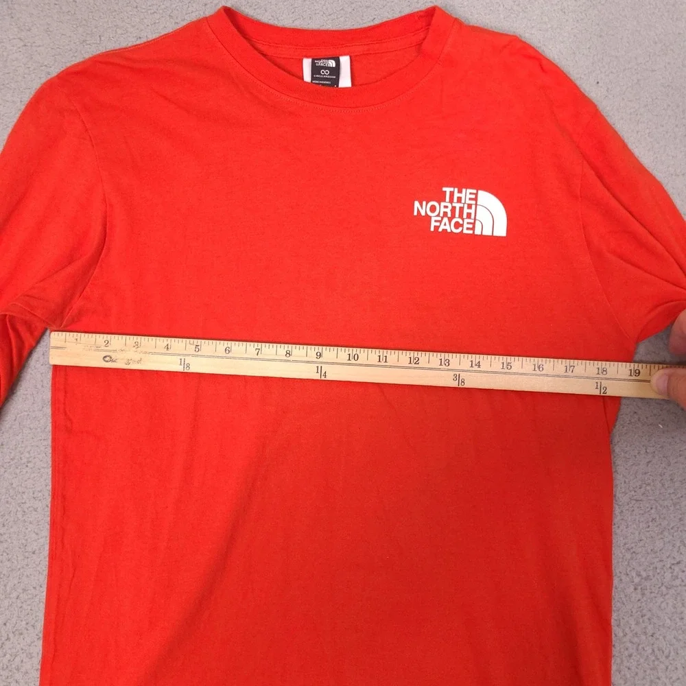 The North Face T-Shirt Mens Small Orange Circular Design Long Sleeve Graphic‎